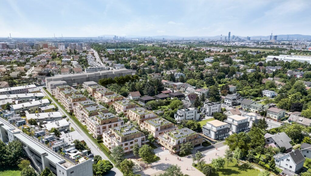 Hübl & Partner Neubauprojekt Am Rain in 1220 Wien nahe dem Badeteich Hirschstetten mit einem traumhaften Anger und niedrigen Bauten - Sicht von oben über das ganze Projekt
